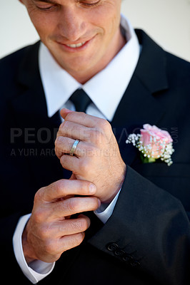 Buy stock photo Groom man, ring and smile for wedding, celebration or commitment to relationship, thinking or pride. Person, gold jewelry and tuxedo suit for marriage, happy and hands at event, party or reception