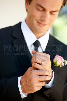 Buy stock photo Groom man, ring and happy for wedding, celebration or commitment to relationship, thinking or pride. Person, metal jewelry and tuxedo suit for marriage, smile and hands at event, party or reception
