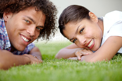 Buy stock photo Love, grass and portrait of couple in nature lying together for bonding, relax and relationship. Dating, happy and face of man and woman in garden for summer picnic on holiday, vacation and weekend