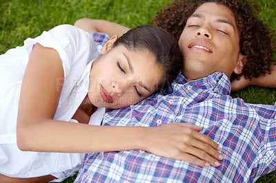 Buy stock photo Grass, happy and couple relax in garden outdoors for bonding, loving relationship and date. Dating, nature and man and woman with eyes closed together in field for romantic picnic, holiday or weekend