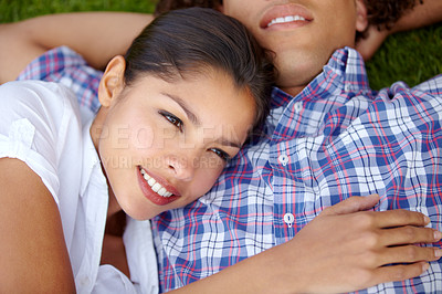 Buy stock photo Grass, happy and couple relax in garden outdoors for bonding, loving relationship and date. Dating, nature and face of man and woman together in field for romantic picnic, holiday and vacation