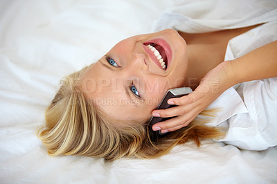 Buy stock photo Happy, phone call and young woman on bed in the morning in her modern apartment or home. Excited, smile and female person from Australia on mobile conversation with cellphone in bedroom at house.