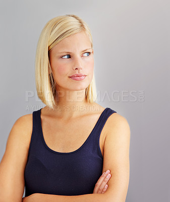Buy stock photo Angry, frustrated and woman with arms folded, cross and sad isolated on a gray studio background. Thinking, depression and blonde person annoyed at fail, mistake or anxiety, doubt and body language