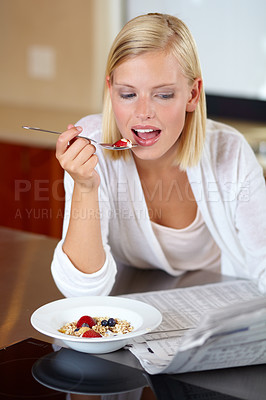 Buy stock photo Woman, eating breakfast and reading newspaper to relax, peace and newsletter at home. Female person, breaking news and announcement or information, article and nutrition or fiber, fruit and health