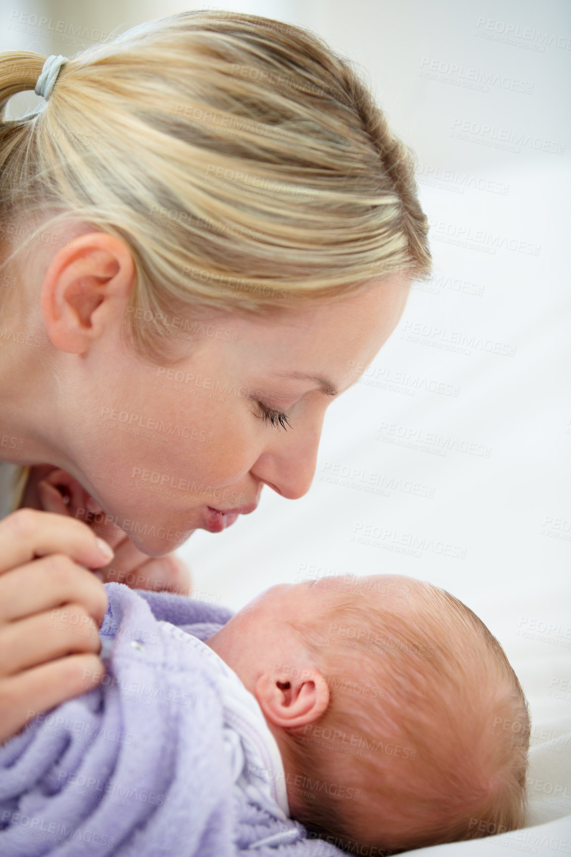 Buy stock photo Relax, kiss and bed, mother and baby bonding, woman and kid lying in home together. Calm morning, mom and newborn in bedroom for fun, love and happy family growth, comfort and child care from above