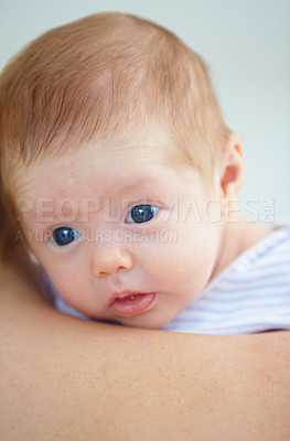 Buy stock photo Family, shoulder and parent with baby in home for bonding, loving relationship and affection. Love, bedroom and closeup of mother carrying newborn for child development, growth and care in nursery