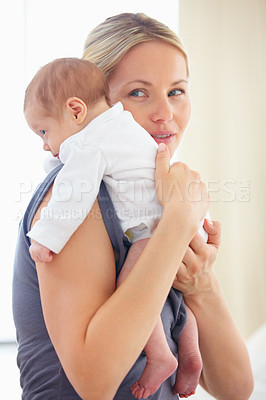 Buy stock photo Mother, holding and bonding hug with baby for love, care support and gratitude for wellness with commitment. Woman, smile and cute newborn with blonde hair, blue eyes and kindness with trust safety