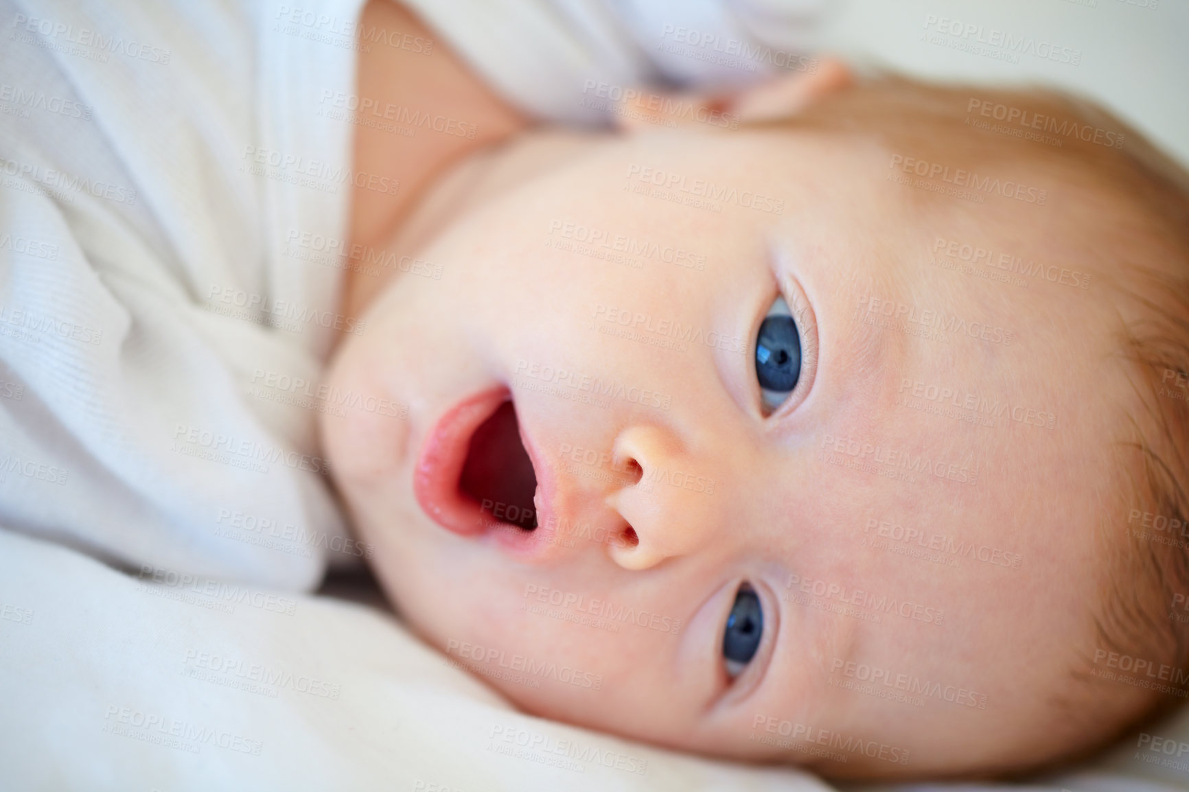 Buy stock photo Closeup portrait of an adorable newborn lying in a cradle