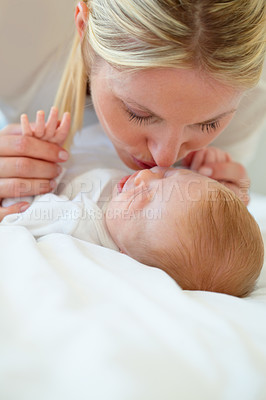 Buy stock photo Closeup, mom and baby with kiss on bed for love, care and bonding in relationship. Infant, sleep or dreaming of hope, future or new life with growth, milestone or child development in family home
