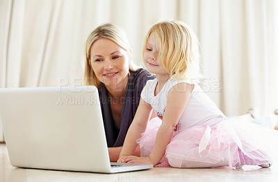Buy stock photo Shot of a mother and daughter bonding while surfing the internet together
