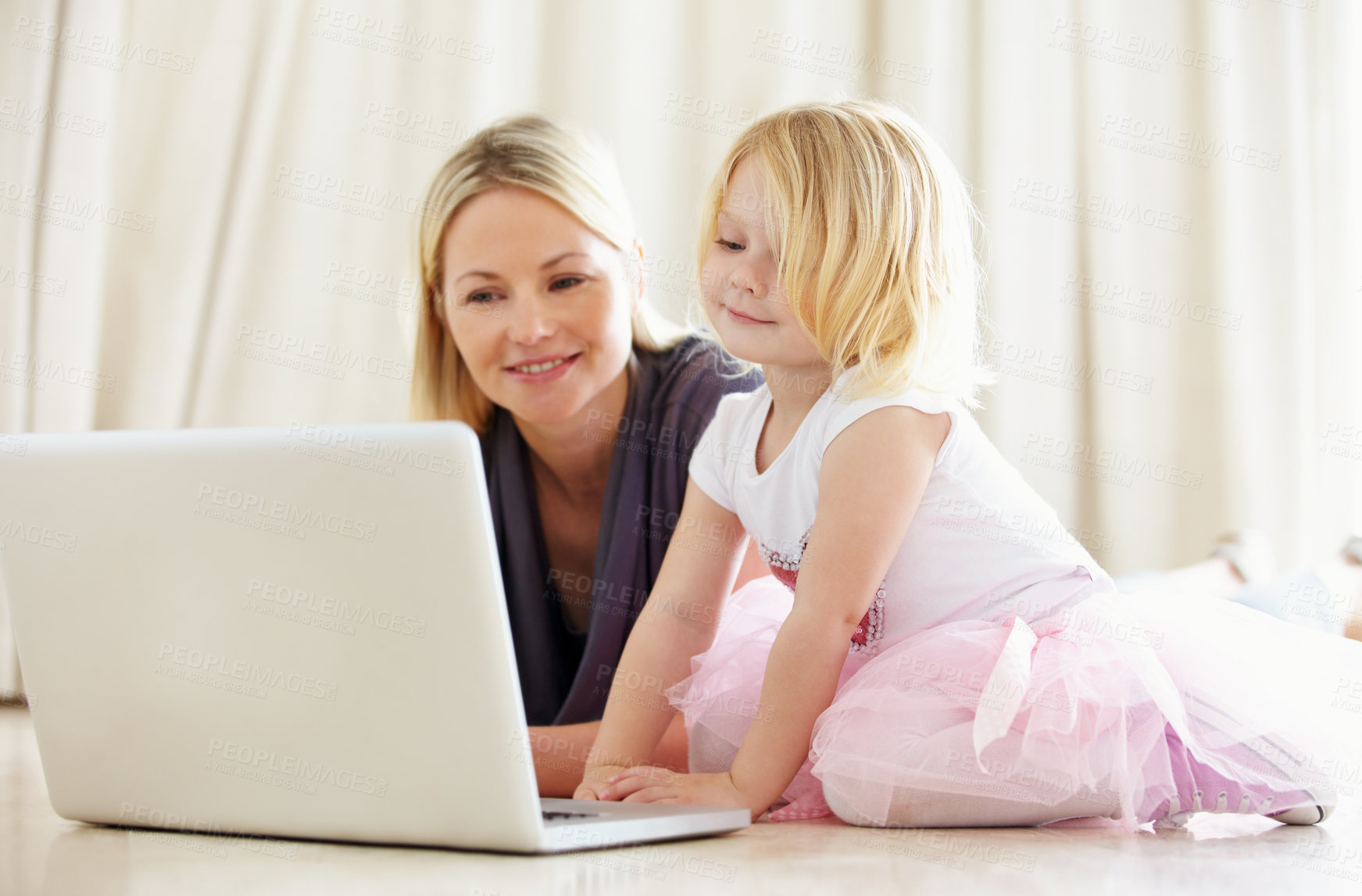 Buy stock photo Shot of a mother and daughter bonding while surfing the internet together