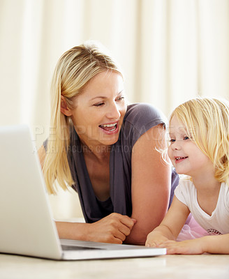Buy stock photo Online, learning and mom with girl on laptop with development, games and education in home. House, computer and mother with child in living room on website for growth and knowledge on internet