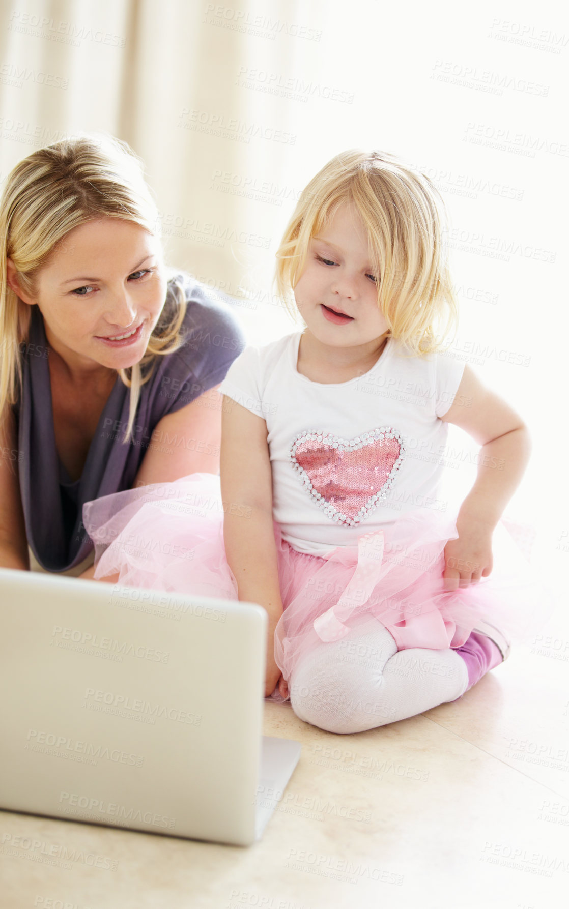 Buy stock photo Shot of a mother and daughter bonding while surfing the internet together