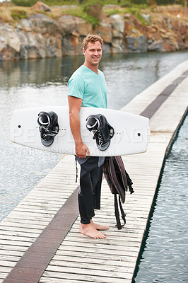 Buy stock photo Sports, portrait and man by lake with wakeboard for surfing, exercise and recreation hobby outdoors. Fitness, extreme sport and person with board for water skiing for freedom, adventure and fun