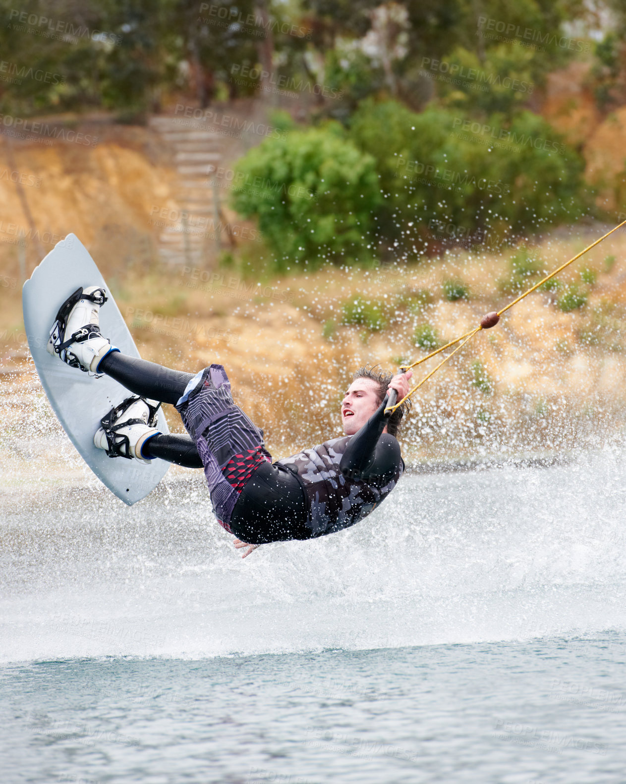 Buy stock photo Jump, wakeboarding and adventure, man on lake with outdoor fun, fitness and wave splash. Balance, water sports and person on river with freedom, speed and energy for surfing challenge, ski and trick