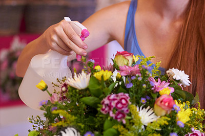 Buy stock photo Flowers, spray water and woman florist with bouquet in store for order, floral gift and service. Spring, nature and female person spraying flower arrangement for moisture, healthy plants and bloom