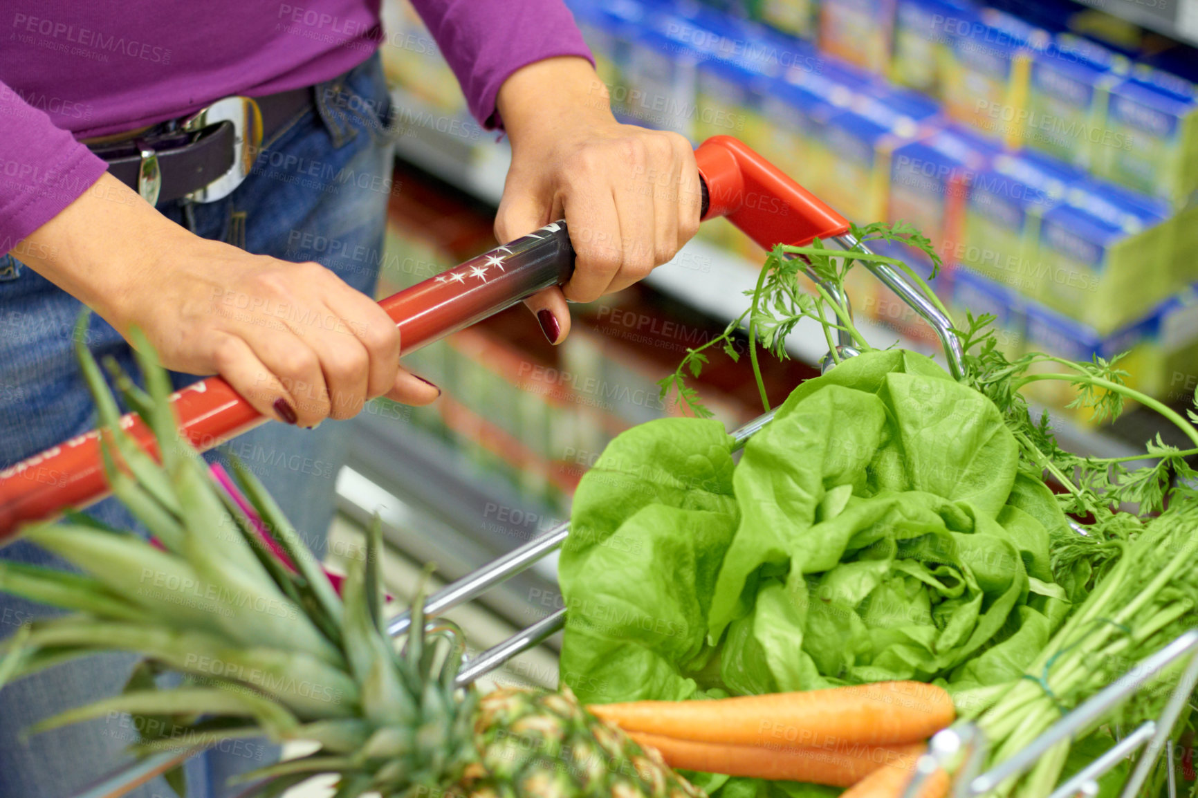 Buy stock photo Woman, shopping cart and customer with grocery, vegetables or fruit and healthy food for diet, nutrition and supermarket. Market, store or person to shop groceries and carrot, lettuce and pineapple