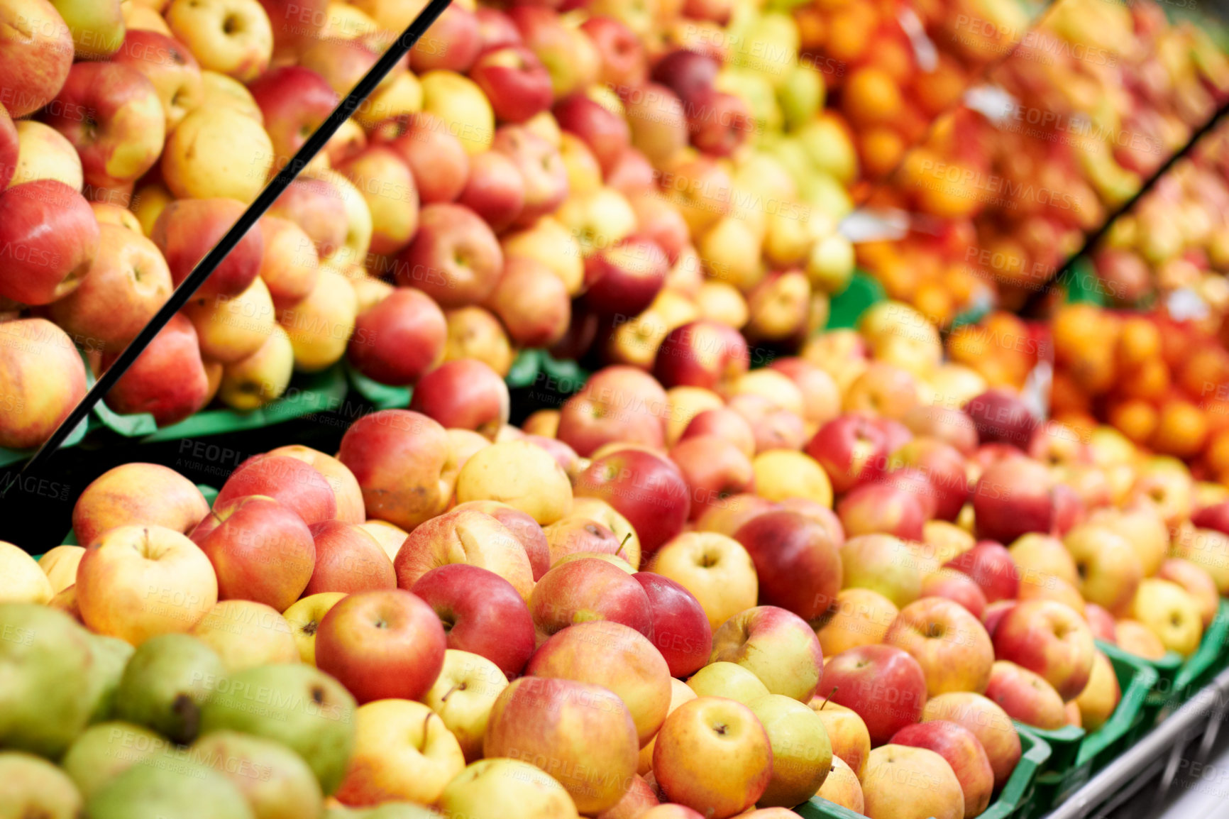 Buy stock photo Health, supermarket and closeup of red apples for nutrition, wellness or organic raw diet. Food, shop and zoom of healthy, natural and fresh fruit in baskets at retail farmers market or grocery store