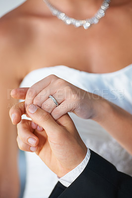 Buy stock photo Couple, wedding ring and holding hands hand in marriage with bride at celebration and trust event. Jewelry, loyalty and care with romance and ceremony with love and commitment with woman and man