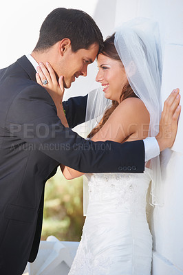 Buy stock photo Bride, groom and wedding hug outdoor with love, care and excited for life event, union or trust. Love, happy and couple embrace outside marriage ceremony with support, security and excited for future