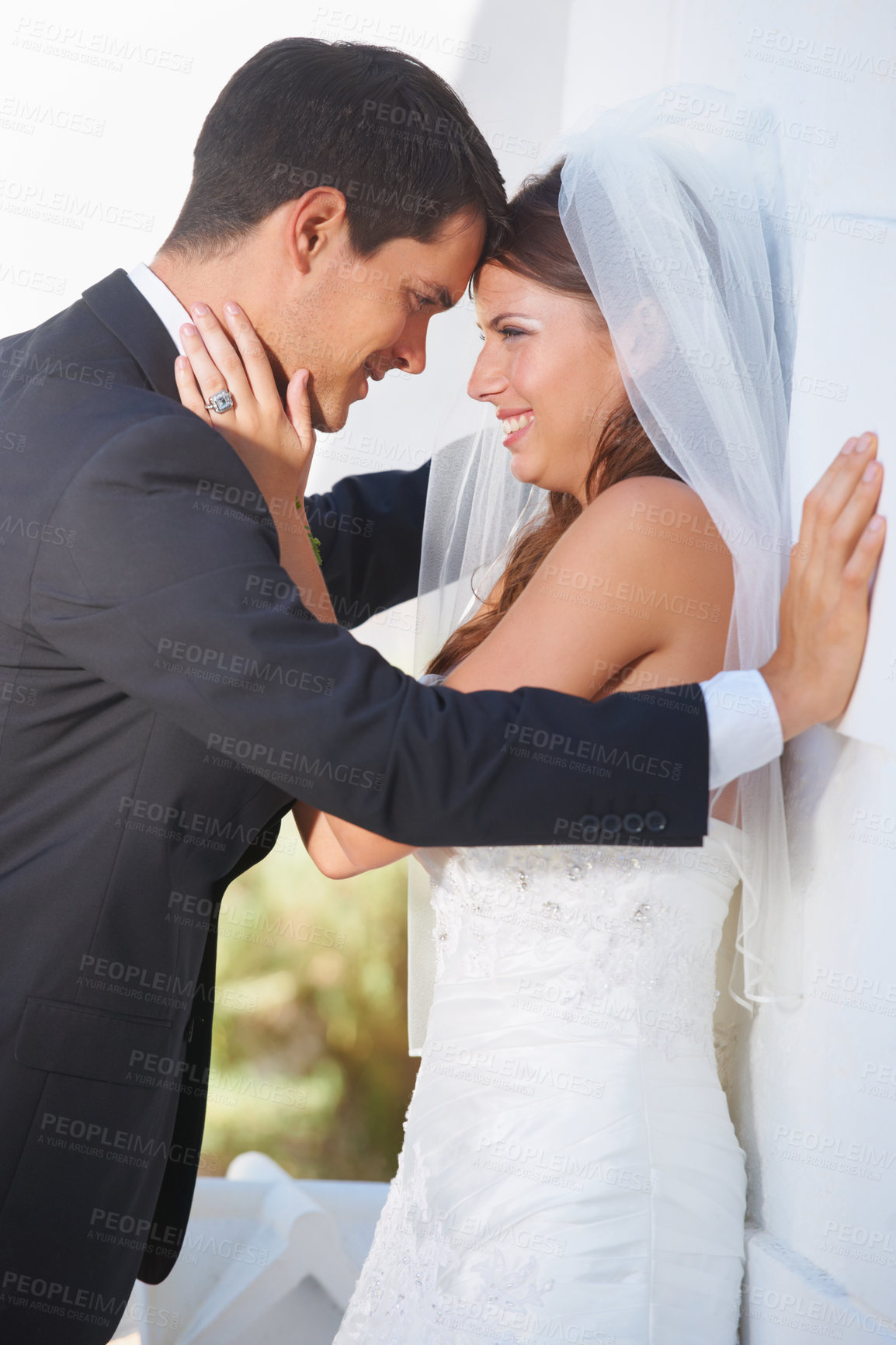 Buy stock photo Bride, groom and wedding hug outdoor with love, care and excited for life event, union or trust. Love, happy and couple embrace outside marriage ceremony with support, security and excited for future