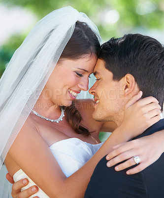 Buy stock photo Wedding day, hug and happy couple outdoor for love, celebration and romantic life event. Face, smile and bride embrace groom outside with support, care and trust, security or excited for their future