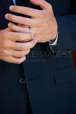 Buy stock photo Groom, hand closeup and ring for marriage, ceremony or celebration in suit, fingers and event. Person, palm and metal jewelry for wedding, party or commitment to relationship, engagement or proposal