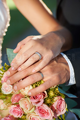 Buy stock photo Couple, wedding ring and hand in marriage with bride and ceremony at celebration and trust event. Flower, loyalty and care with romance and holding hands with love and commitment with woman and man