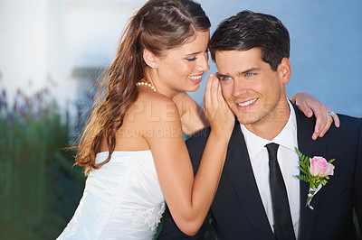 Buy stock photo Woman, man and whisper at wedding, smile and thinking outdoor with secret, story and love with romance. Couple, marriage and happy with talking, gossip or news with care, commitment and celebration