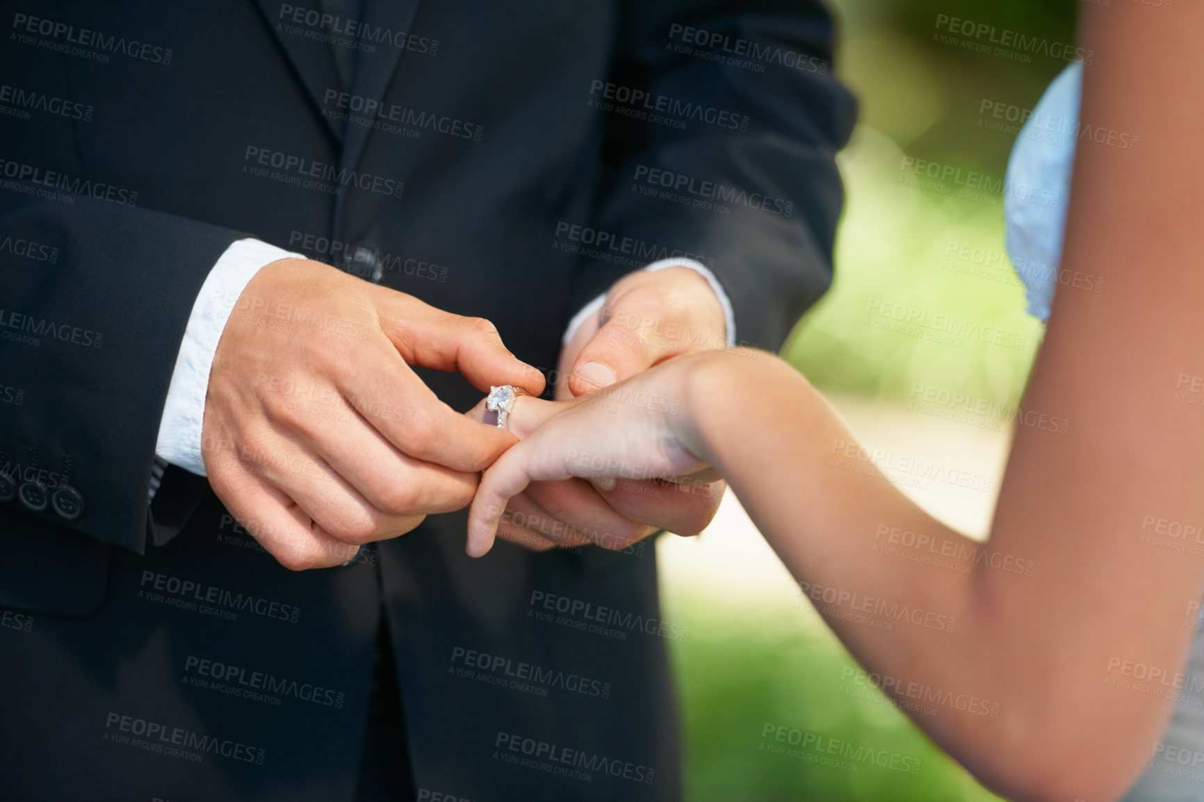Buy stock photo Couple, hands and wedding ring for proposal, commitment or promise in love, care or trust and support at ceremony. Closeup of married man putting jewelry on bride for loyalty, marriage or engagement