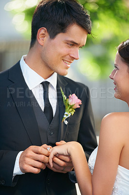 Buy stock photo Bride, groom and wedding ring exchange outdoor with love, care and excited for commitment, union or trust. Smile, happy and couple outside for marriage ceremony with support, security and promise