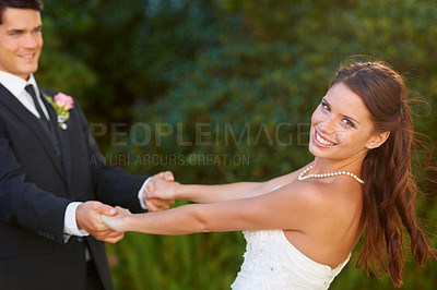 Buy stock photo Bride, groom and wedding dance outdoor with love, celebration and bonding on their special day. Solidarity, couple and happy people holding hands in support of romance, event and marriage success