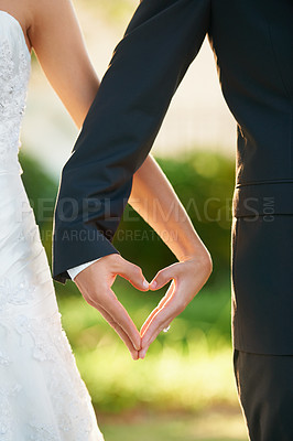 Buy stock photo Hands, bride and groom heart sign at wedding, celebration or vow ceremony and love, couple and marriage. Man, wife and commitment together and care, unity and promise for relationship happiness 