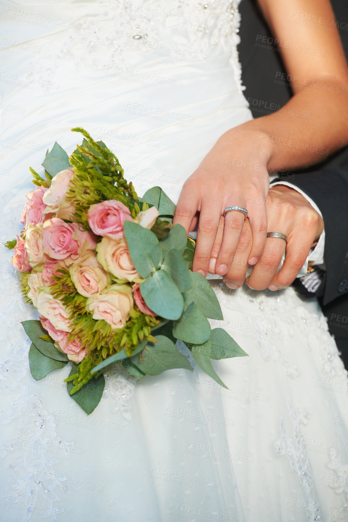 Buy stock photo Couple, wedding ring and hands on rose bouquet in marriage with bride at celebration and event. Flower, loyalty and care with romance with love and commitment with woman and man and floral plant