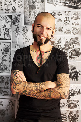 Buy stock photo Shot of a youngm an with tattoos