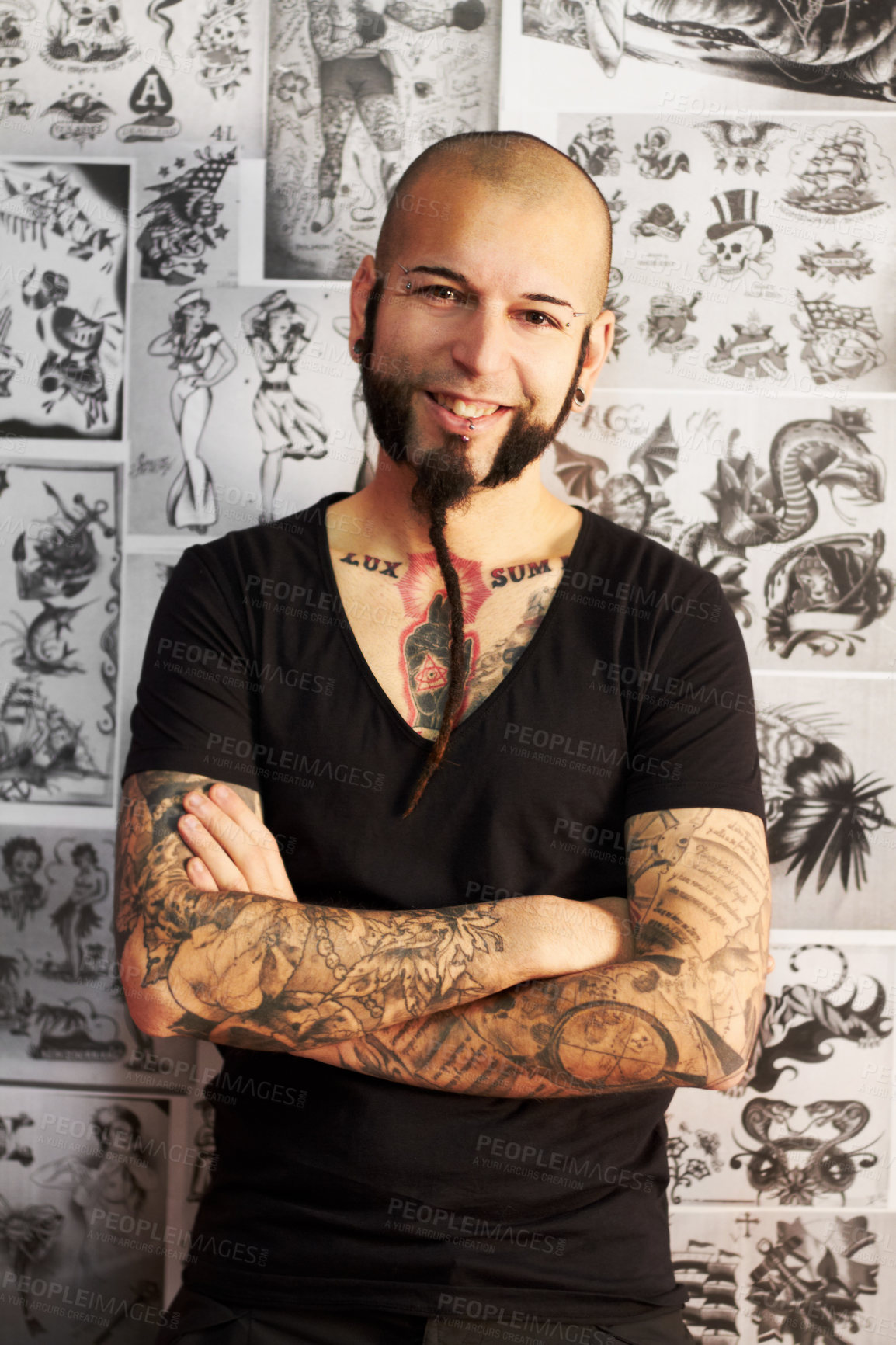 Buy stock photo Shot of a youngm an with tattoos