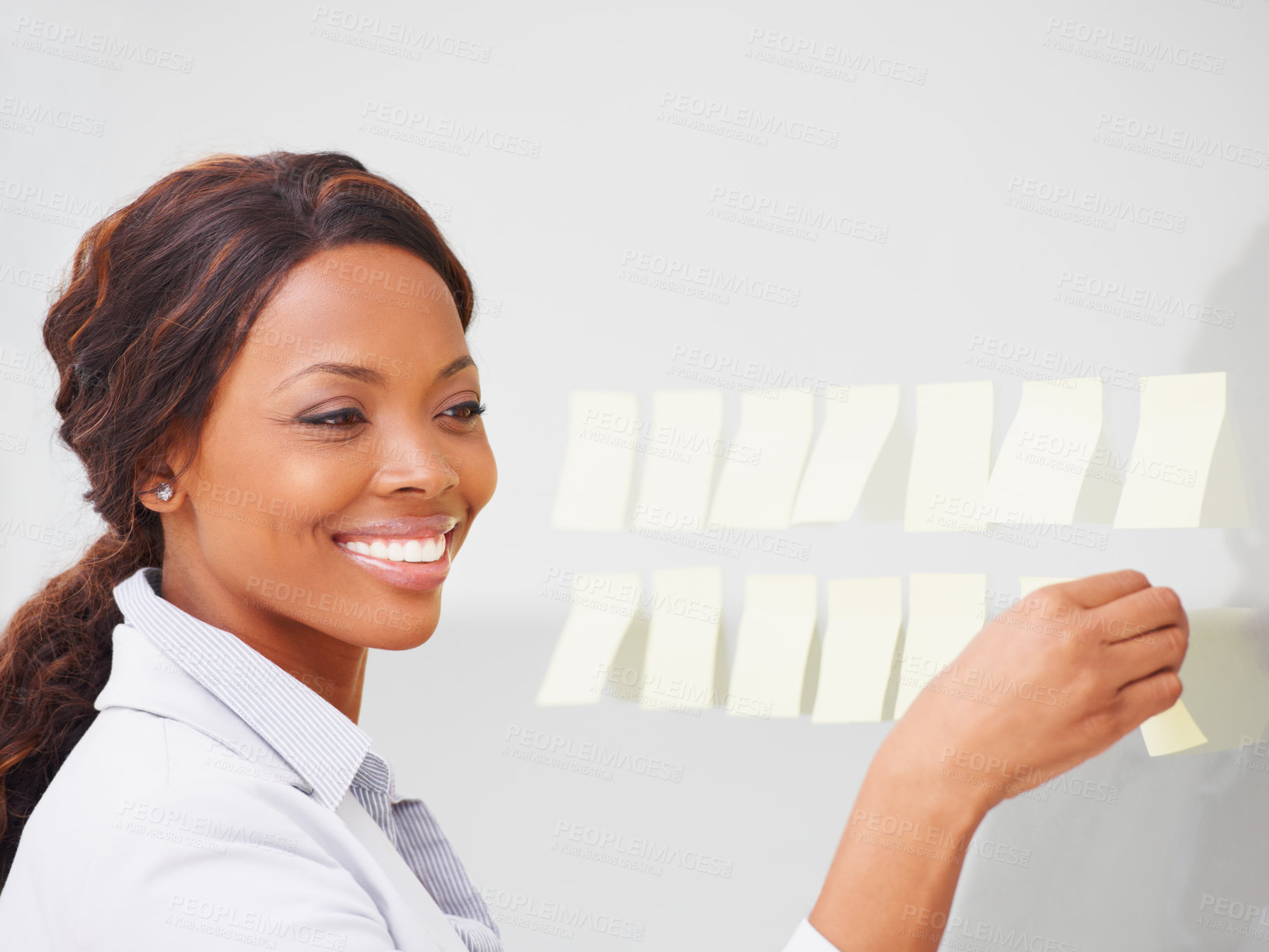 Buy stock photo Business woman, smile and sticky note on board for planning, vision and thinking for solution at company. African entrepreneur, happy and glass with problem solving process for project management