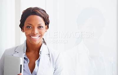 Buy stock photo Portrait of a young woman holding a laptop next to her reflection - copyspace