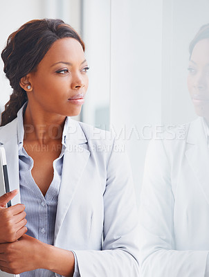 Buy stock photo Thinking, window and future with a business black woman standing in her office for reflection of the company vision. Idea, mission and mindset with a young employee at work to contemplate a thought