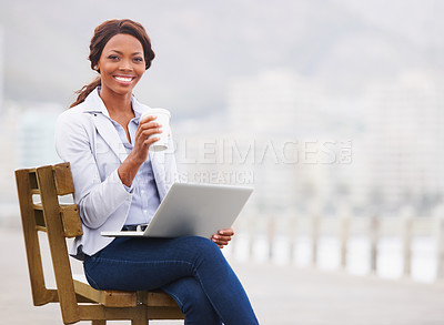 Buy stock photo Black business woman, coffee and laptop on bench, promenade and portrait with smile, drink and beach. Entrepreneur, happy and outdoor with tea cup, computer and nature by ocean with fog in Cape Town