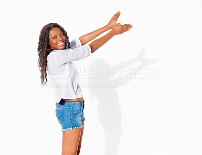 Buy stock photo Bird shadow, black woman and portrait with hands in wings shape flying in a studio. Happy, smile and African female person with modern and casual fashion hand gesture for creative puppet show 