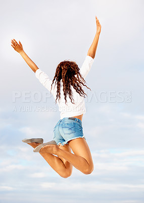 Buy stock photo Woman, jumping and in air excited with travel, vacation of winner happy from holiday. Winning, African female person back and leap with joy from energy, achievement and freedom in studio with smile