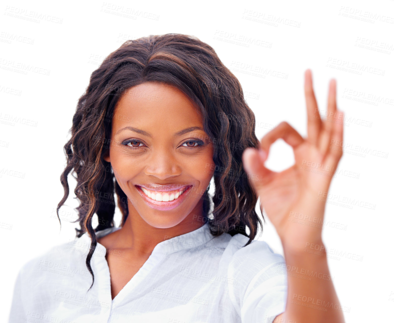 Buy stock photo Cropped view of a pretty african american woman giving an ok sign with a smile