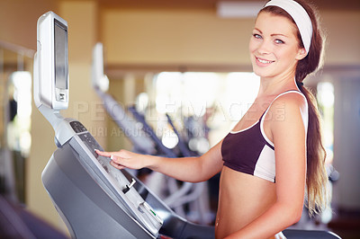 Buy stock photo Woman, gym portrait and treadmill with smile, start button and happy for fitness, wellness and health. Girl runner, running machine and happiness for workout, exercise or training for self care goal