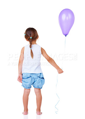 Buy stock photo Full length rearview of a little girl holding a balloon