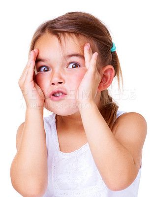 Buy stock photo Studio shot of a cute little girl pulling a face for the camera