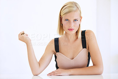 Buy stock photo Gorgeous young woman sitting and snapping her fingers