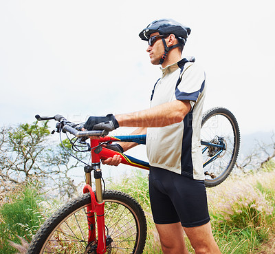 Buy stock photo Sports, bike and fitness with a man in the mountains for cardio training, recreation or a summer hobby. Nature, cycling and freedom with a confident young athlete outdoor for eco friendly exercise