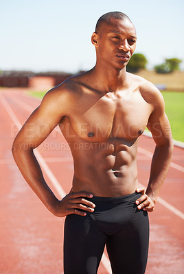 Buy stock photo Body, mindset and topless man at a race track for training, fitness and sport, cardio and speed running practice. Stadium, start and African male runner serious, focus and ready for performance run
