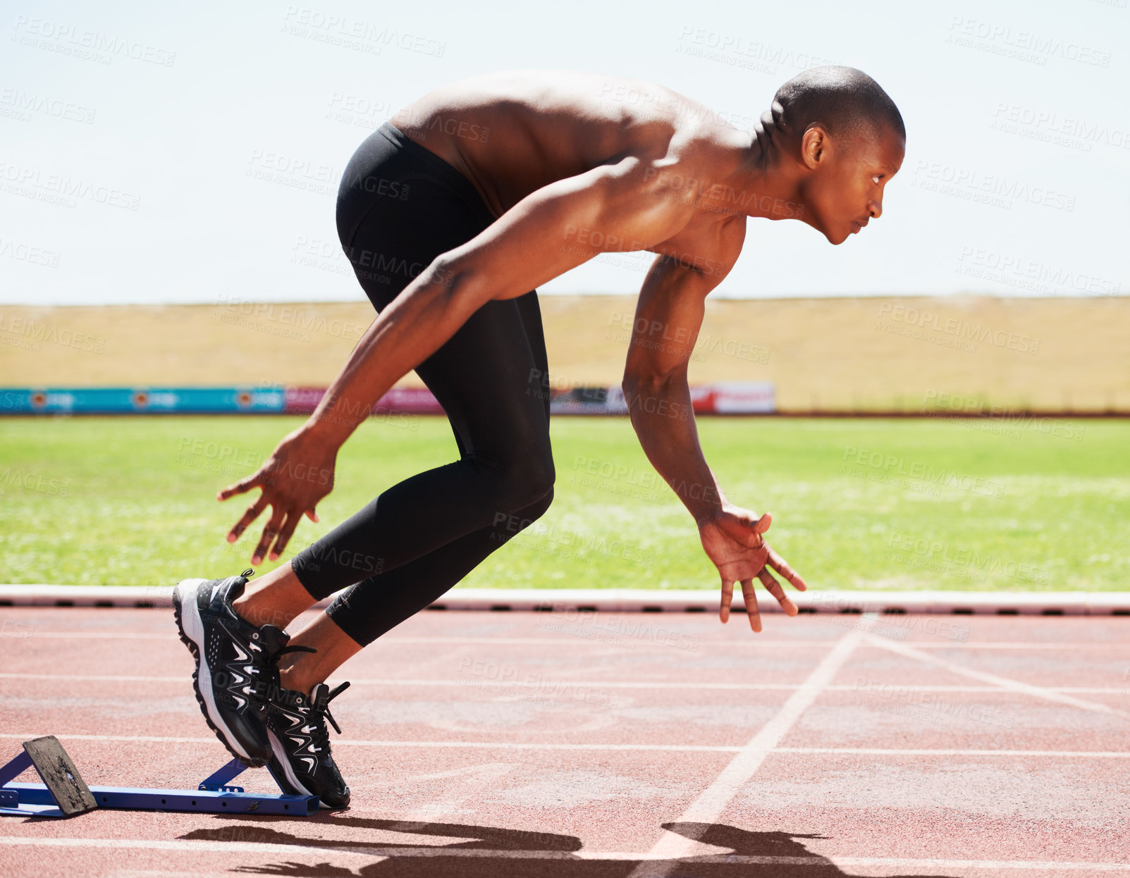 Buy stock photo Man, runner and starting line for sprint, athlete and ready for marathon, wellness and race or competition. Black male person, training and exercising or active, practice and blocks for fitness